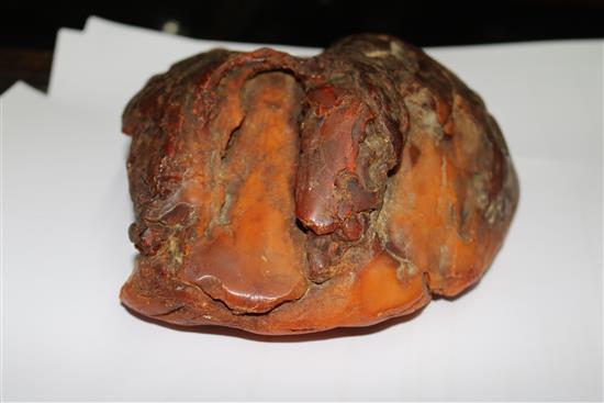 A large piece of raw amber, gross weight 1084 grams, approx. 7in by 7in by 3in.